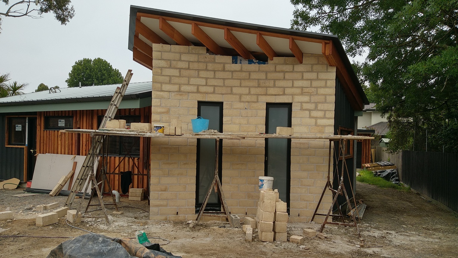 Timbercrete cladding reaches the top of the wall